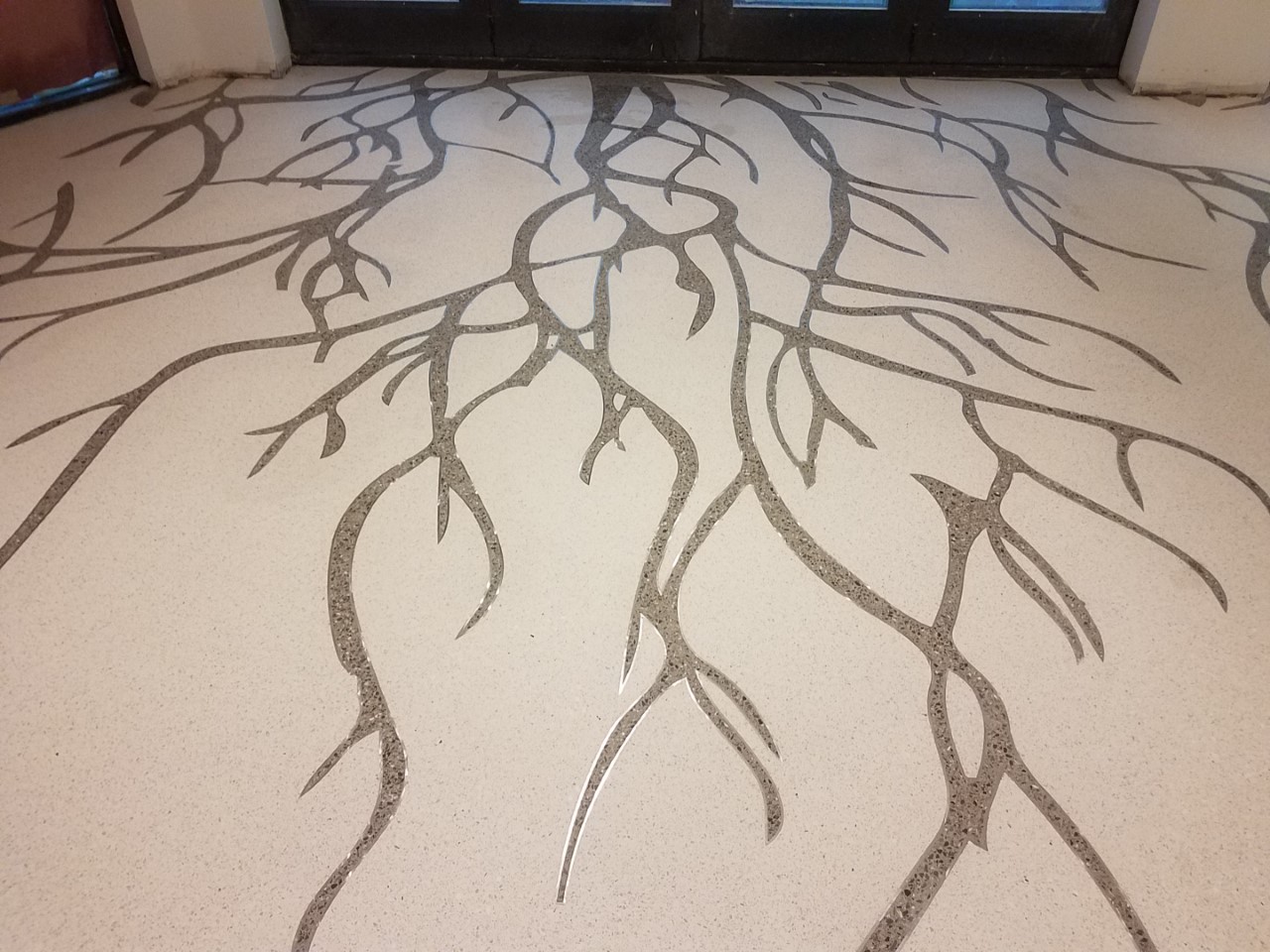 A close up of the floor with branches drawn on it