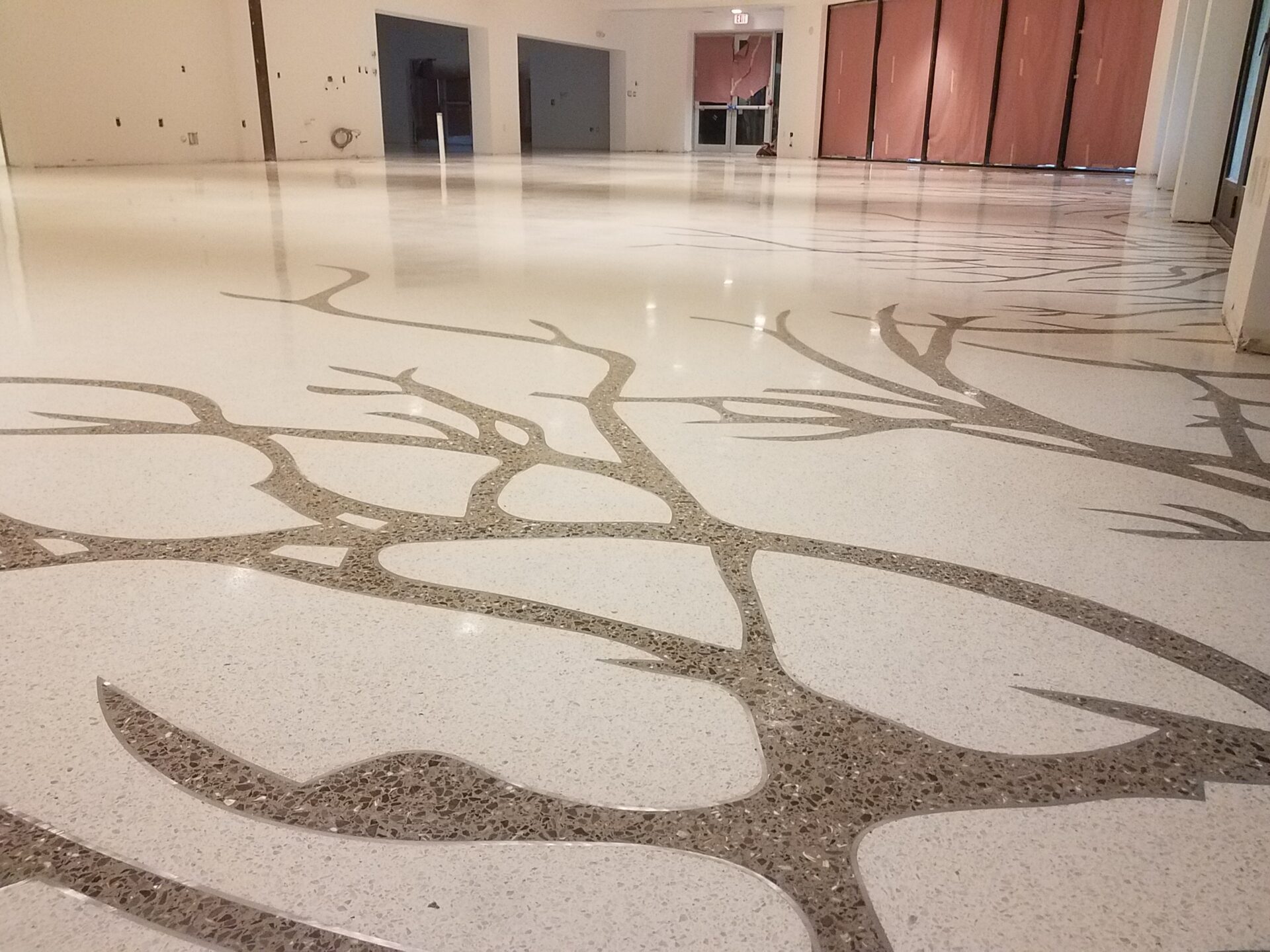 A floor with a tree design on it