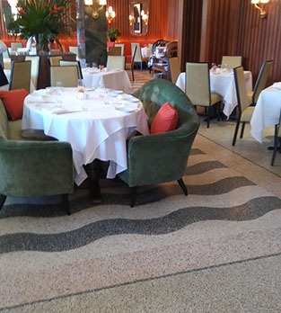 A restaurant with tables and chairs in it