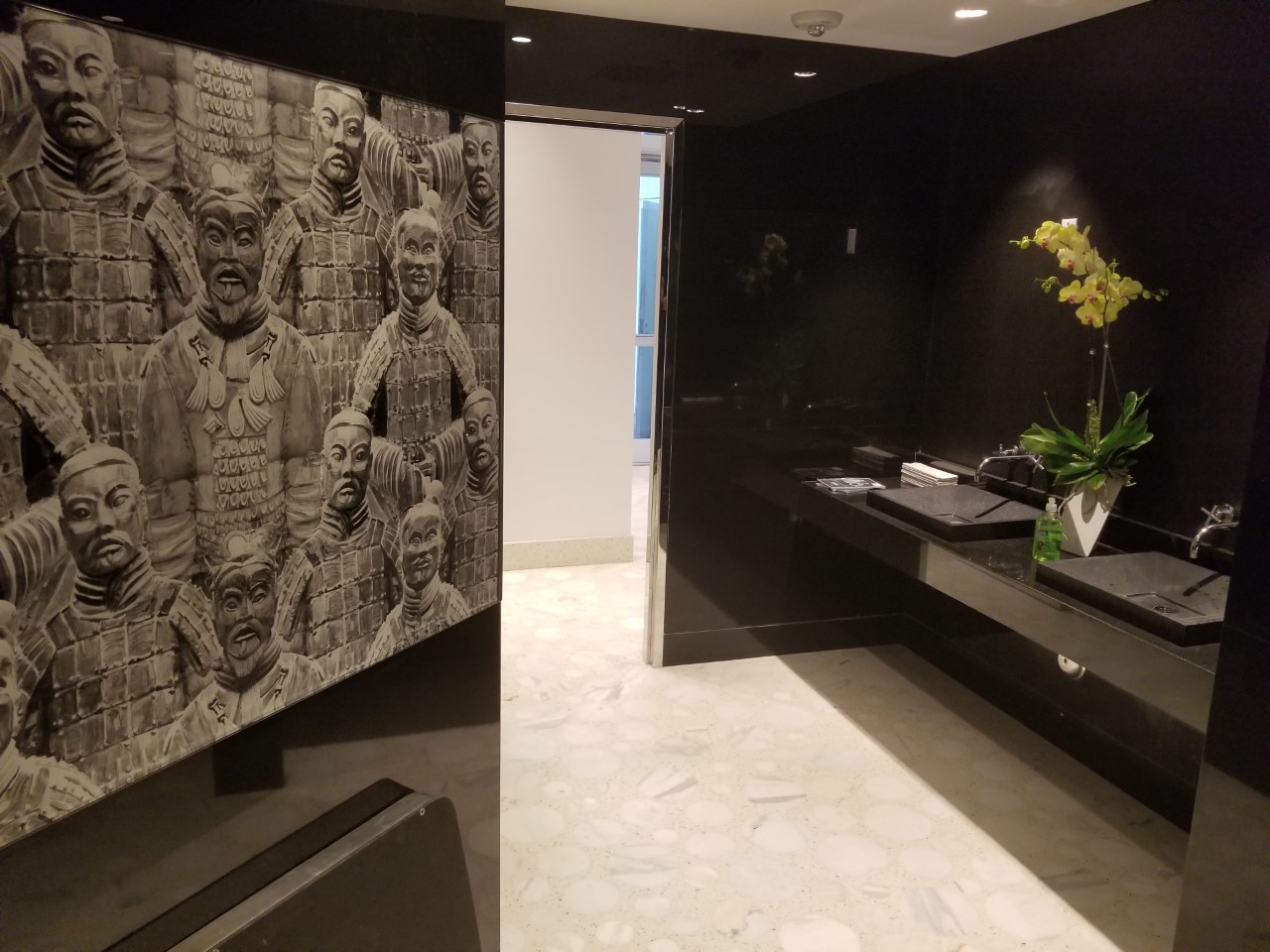 A room with black walls and white tile floors.