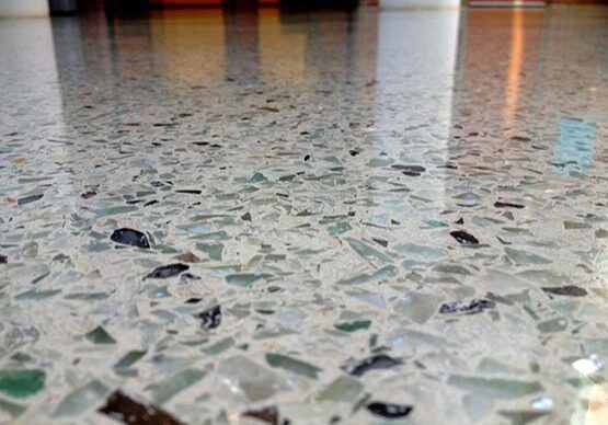 A close up of the floor with many glass pieces